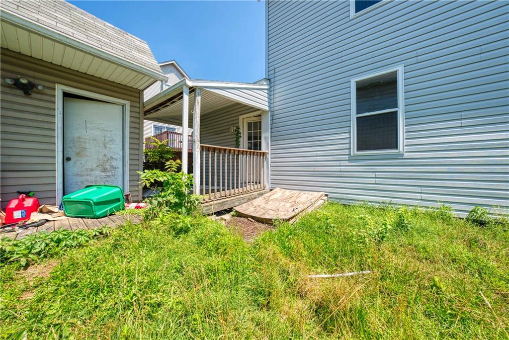 522 Jefferson Street Rochester, PA 15074 - Photo 28 of 28 a view of a house with a yard and flower garden