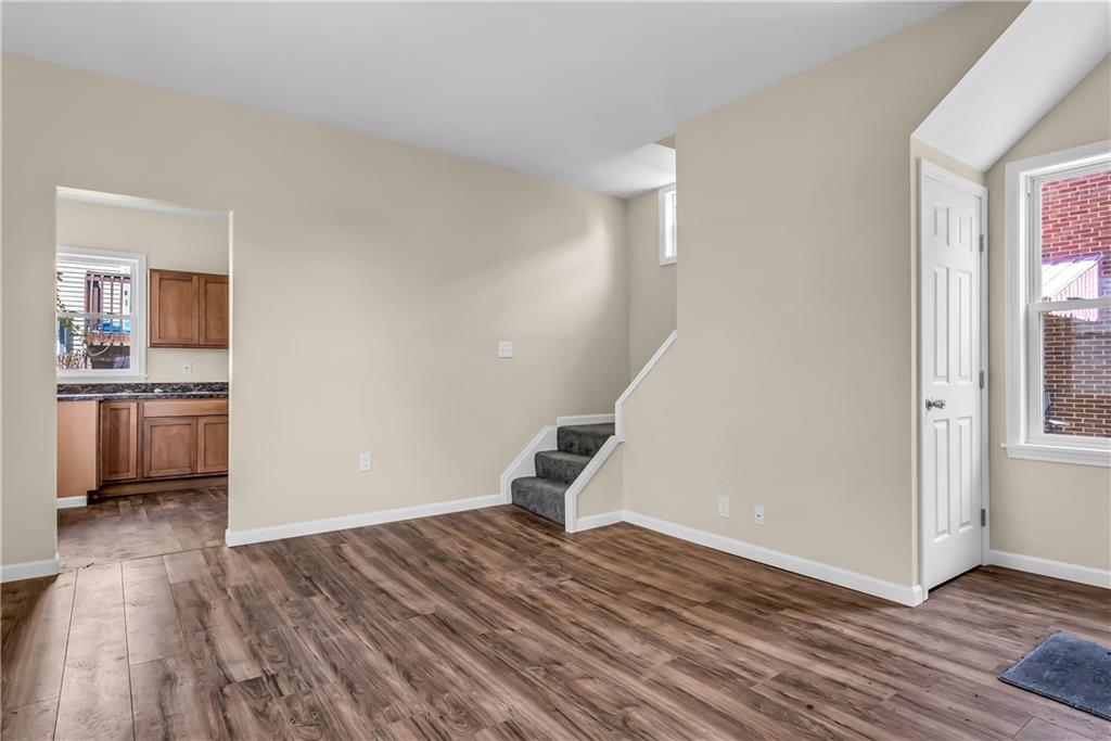 522 Jefferson Street Rochester, PA 15074 - Photo 5 of 28 a view of empty room with wooden floor and window