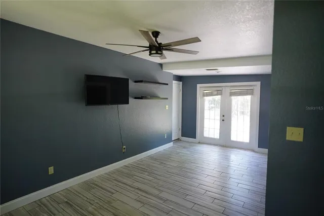 a view of a livingroom with a flat screen tv