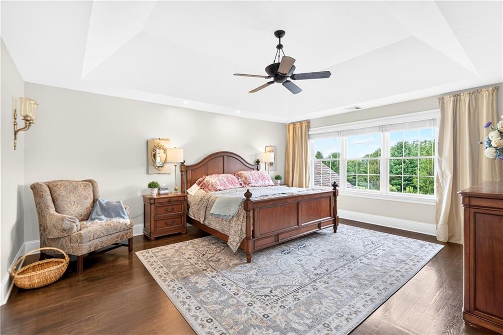 486 Settler Road Ligonier, PA 15658 - Photo 26 of 49 Step into the Homeowners Retreat, 20x15 Bedroom, Hardwood, Tray Ceiling, light remote operated Ceiling Fan. recessed ceiling lighting.