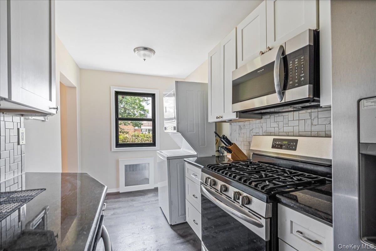 16-37 Utopia Parkway, Unit 233 Queens, NY 11357 - Photo 7 of 16 Kitchen with appliances with stainless steel finishes