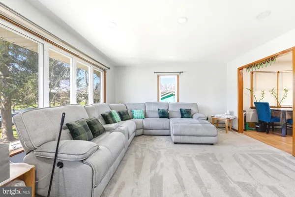 a living room with furniture and a large window