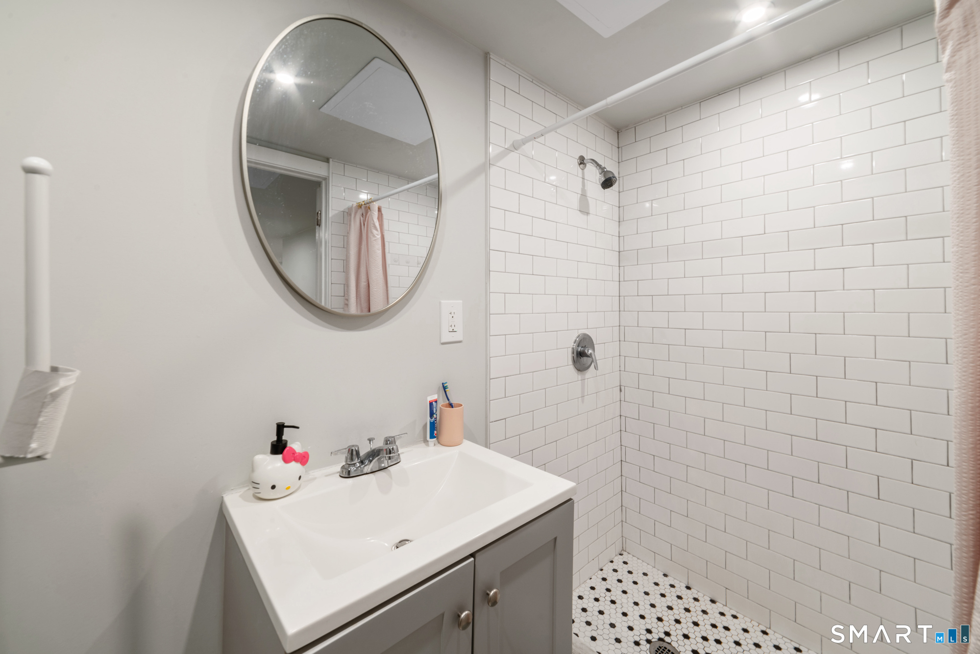 327 Lakeside Boulevard West Waterbury, CT 06708 - Photo 25 of 29 a bathroom with a sink a vanity and a mirror