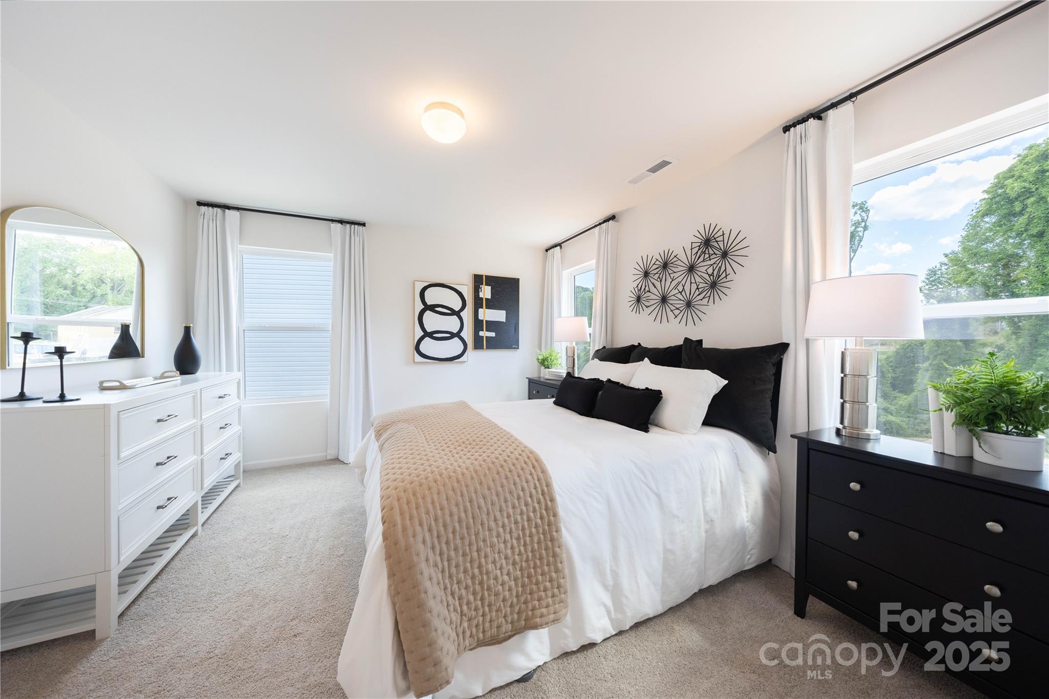 3014 Springvale Street, Unit 21 Charlotte, NC 28208 - Photo 11 of 12 a bedroom with a bed and a window