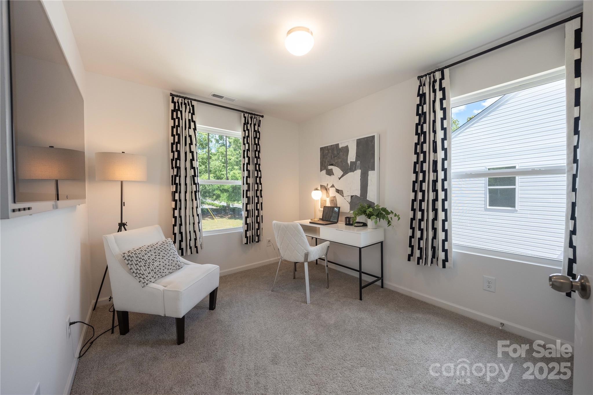 3014 Springvale Street, Unit 21 Charlotte, NC 28208 - Photo 7 of 12 a living room with furniture and a window