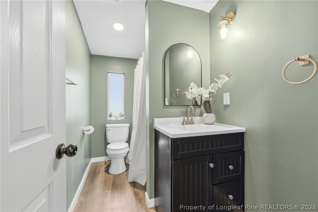78 Georgia Way Cameron, NC 28326 - Photo 15 of 21 a bathroom with a sink a toilet and a mirror