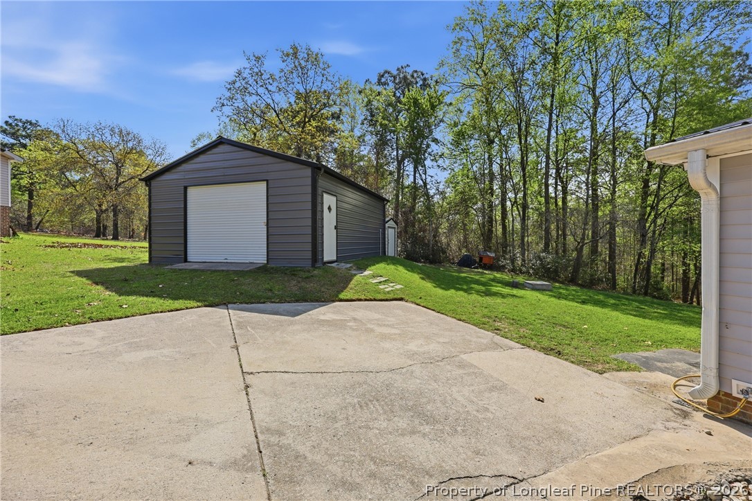78 Georgia Way Cameron, NC 28326 - Photo 16 of 21 a view of a back yard of the house