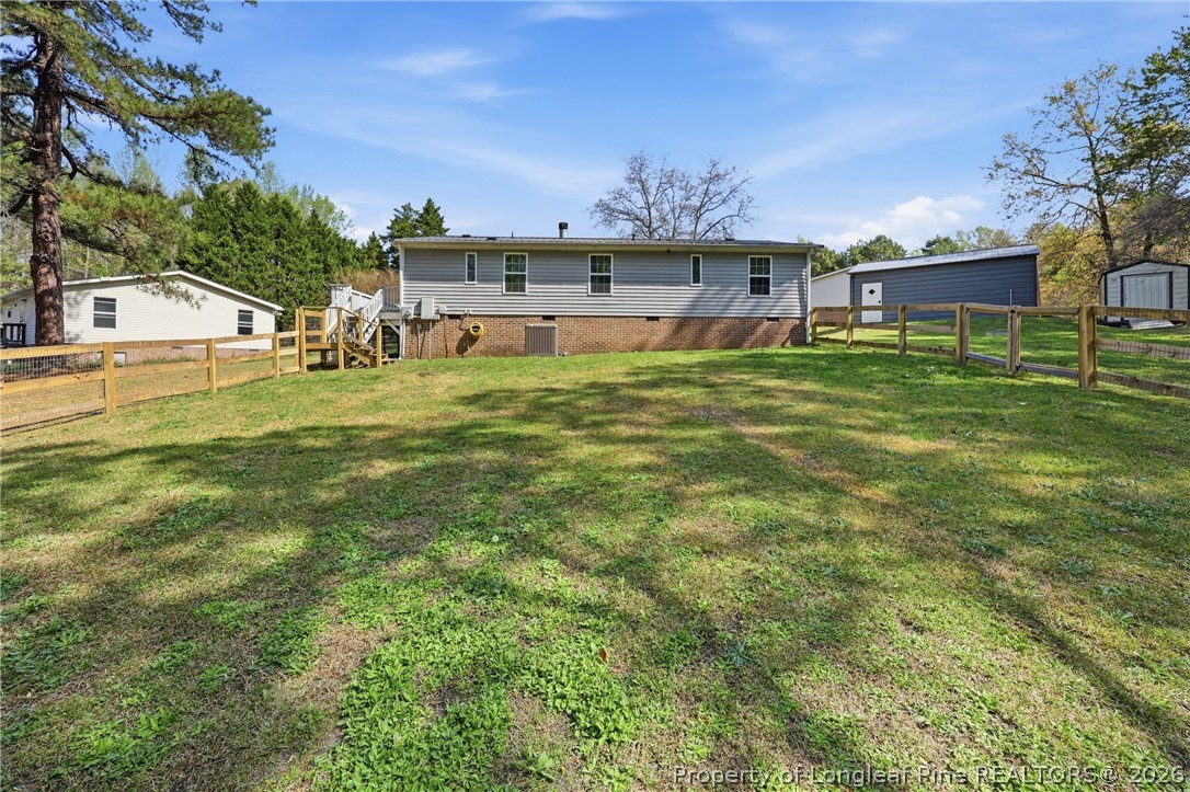 78 Georgia Way Cameron, NC 28326 - Photo 18 of 21 a front view of a house with a garden