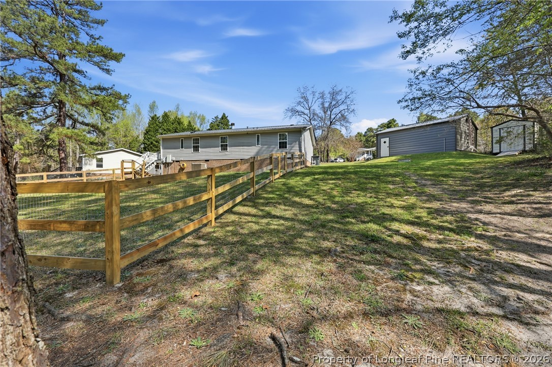 78 Georgia Way Cameron, NC 28326 - Photo 19 of 21 a view of a house with a yard
