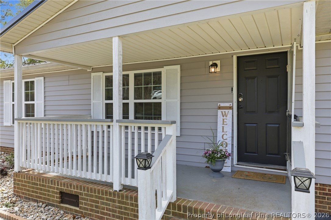 78 Georgia Way Cameron, NC 28326 - Photo 2 of 21 a front view of a house with a porch