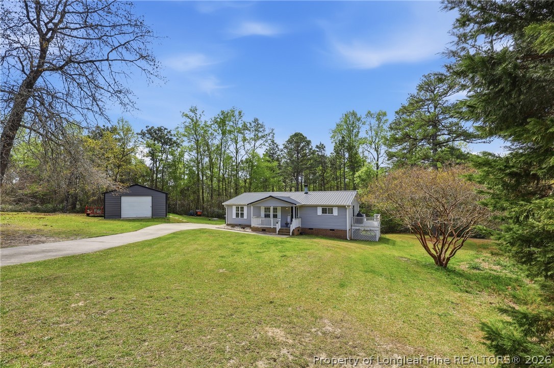 78 Georgia Way Cameron, NC 28326 - Photo 21 of 21 a view of a house with a yard and sitting area