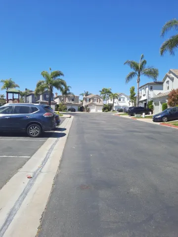 a view of a street with cars