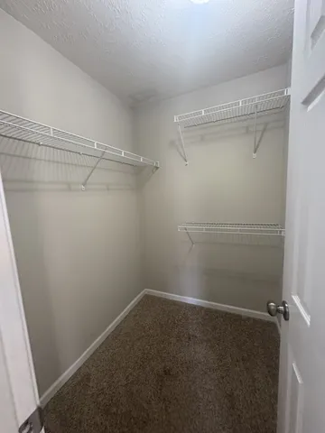 a view of a room with racks on the wall