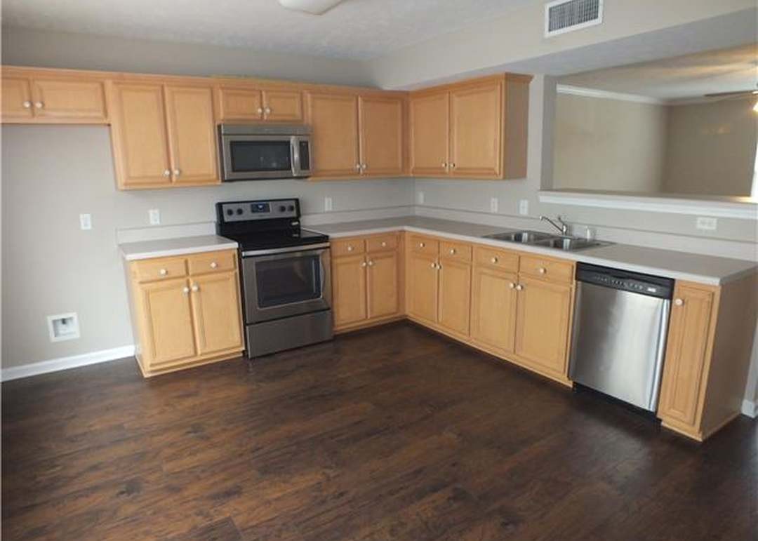 4112 Nir Shreibman Boulevard La Vergne, TN 37086 - Photo 2 of 24 a kitchen with granite countertop a stove top oven sink and cabinets