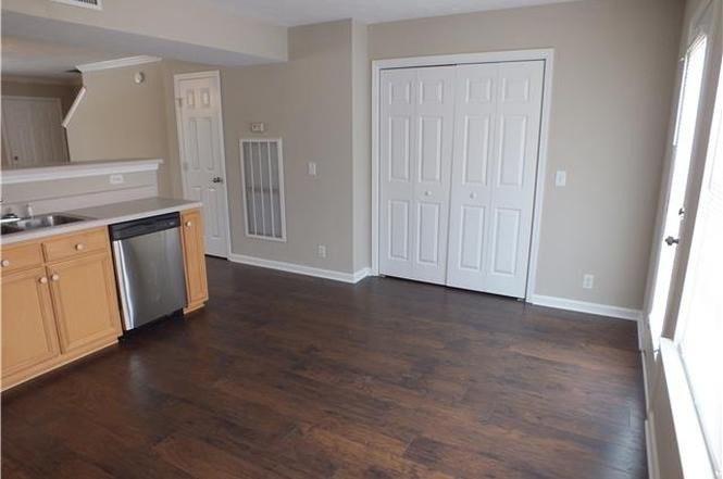 4112 Nir Shreibman Boulevard La Vergne, TN 37086 - Photo 3 of 24 an empty room with wooden floor and cabinet