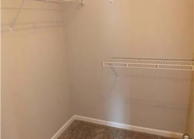 a view of a room with racks on the wall