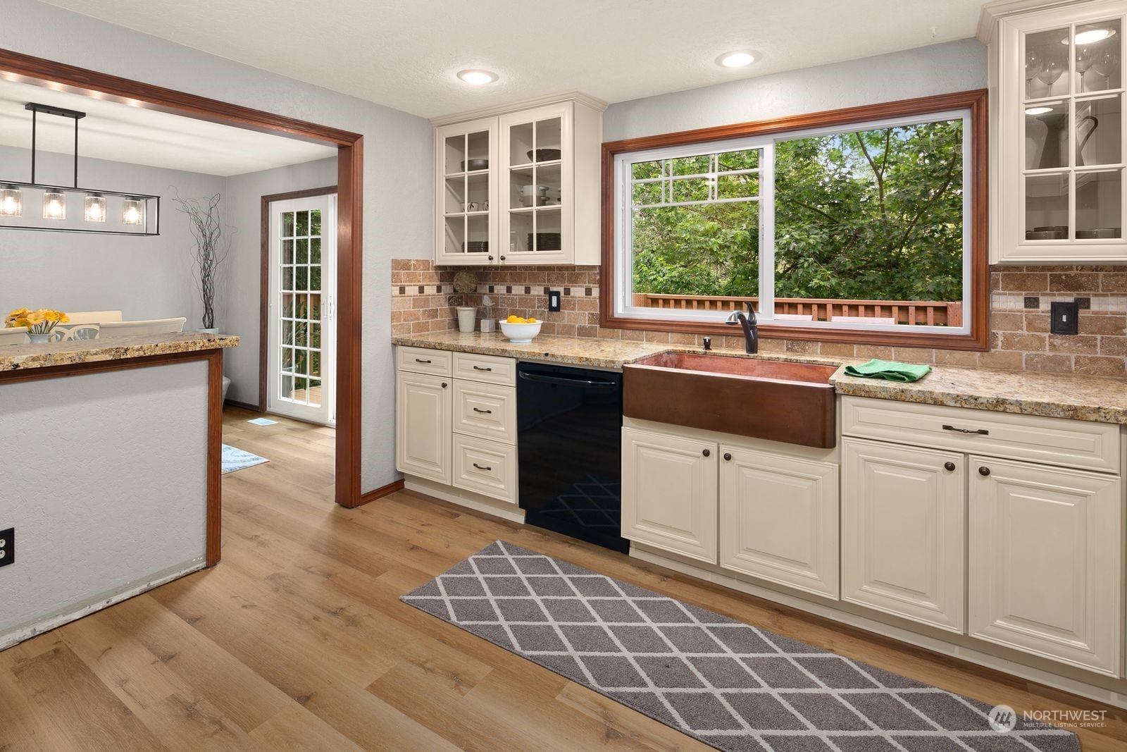 23211 3rd Avenue Southeast Bothell, WA 98021 - Photo 11 of 40 a kitchen with a sink stove and cabinets