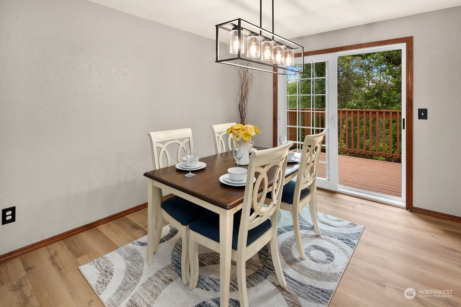 23211 3rd Avenue Southeast Bothell, WA 98021 - Photo 12 of 40 a view of a dining room with furniture wooden floor and chandelier