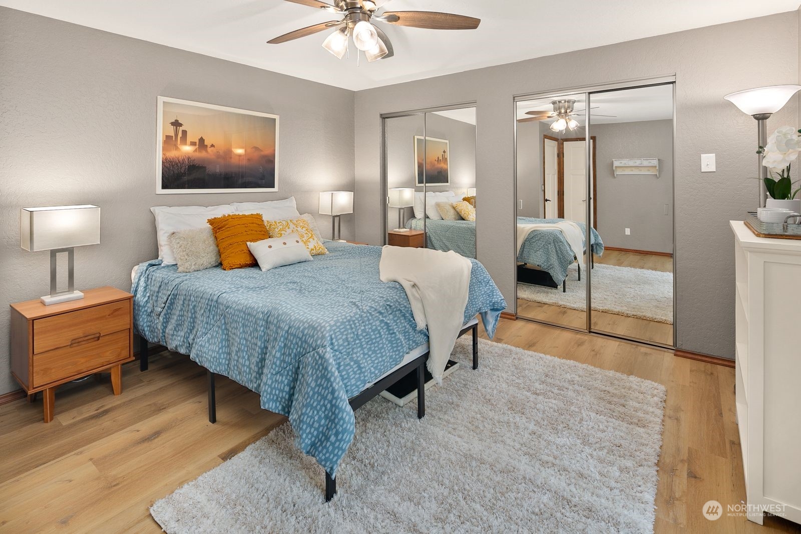 23211 3rd Avenue Southeast Bothell, WA 98021 - Photo 15 of 40 a spacious bedroom with a bed and a chandelier