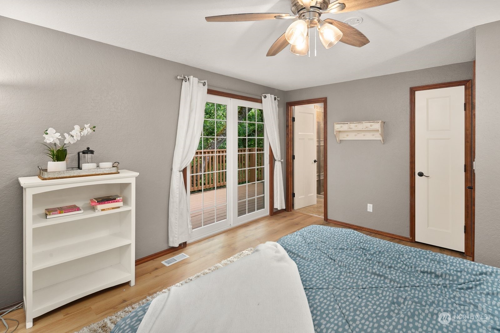 23211 3rd Avenue Southeast Bothell, WA 98021 - Photo 16 of 40 a bedroom with a bed and a chandelier
