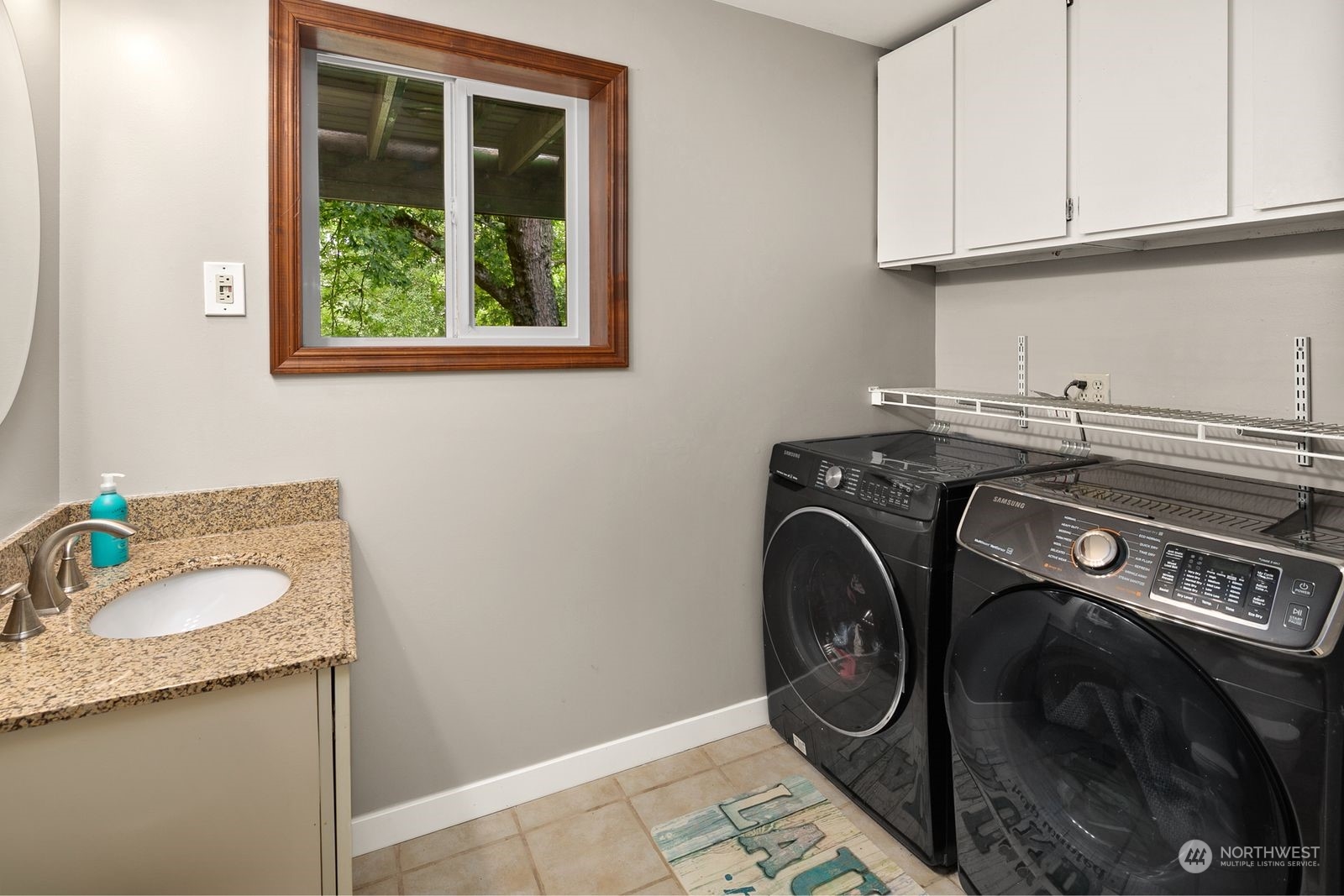 23211 3rd Avenue Southeast Bothell, WA 98021 - Photo 25 of 40 a utility room with sink dryer and washer