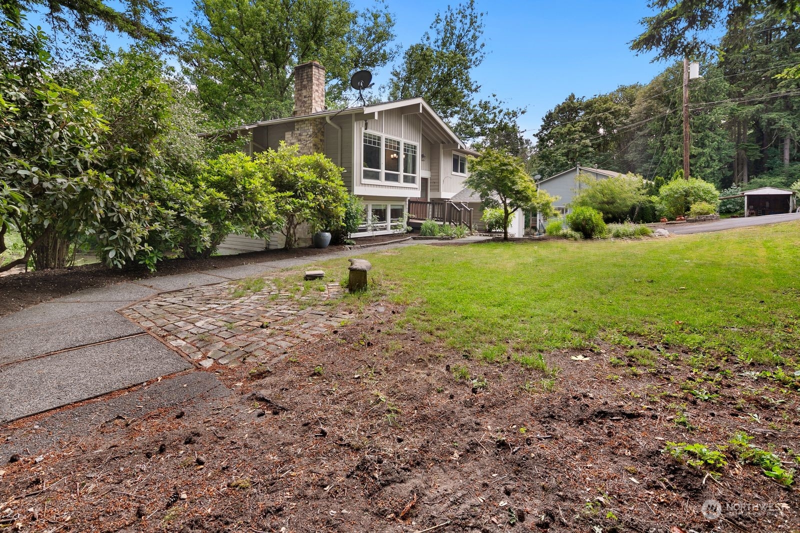 23211 3rd Avenue Southeast Bothell, WA 98021 - Photo 5 of 40 a front view of a house with garden
