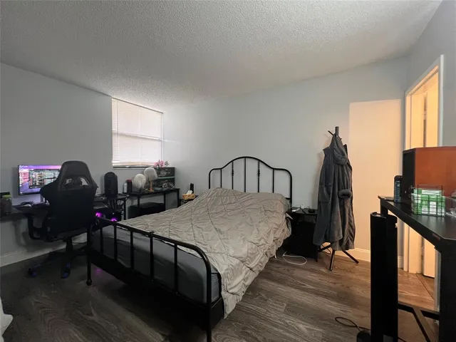 a view of a hallway with a large window and stairs