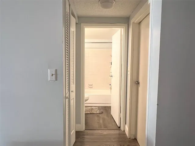 a view of a street with a building in the background