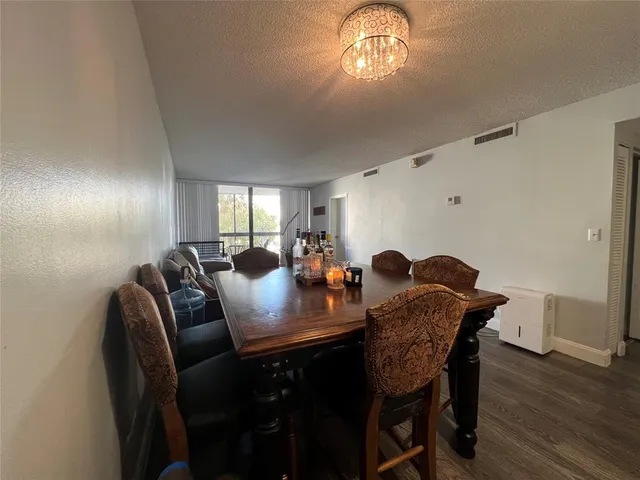 a bathroom with a double vanity sink toilet mirror and tub