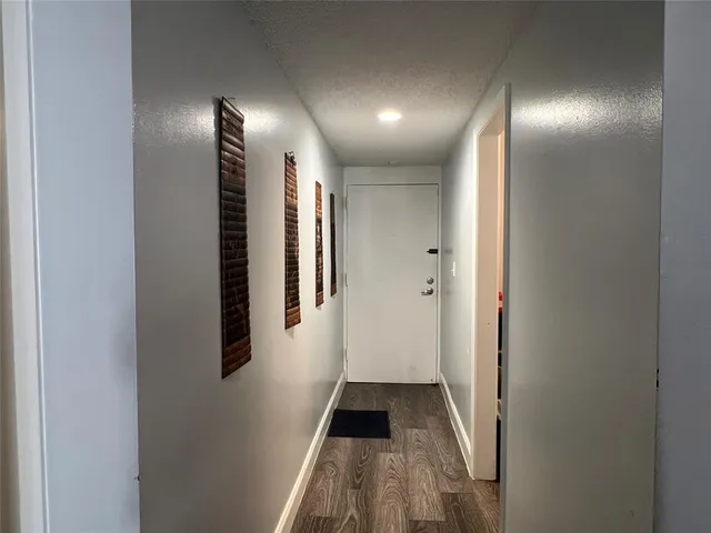 a white toilet sitting next to a bath tub