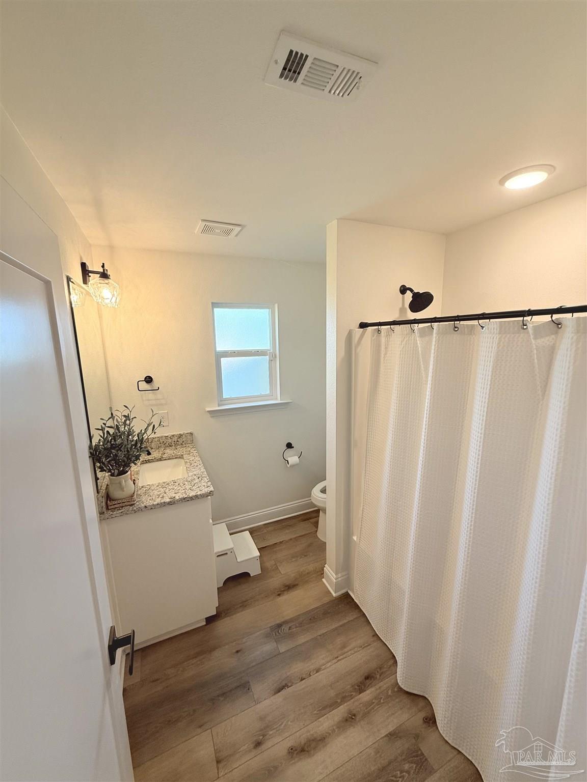 2351 Harvest Road Jay, FL 32565 - Photo 11 of 14 a bathroom with a sink a toilet and shower