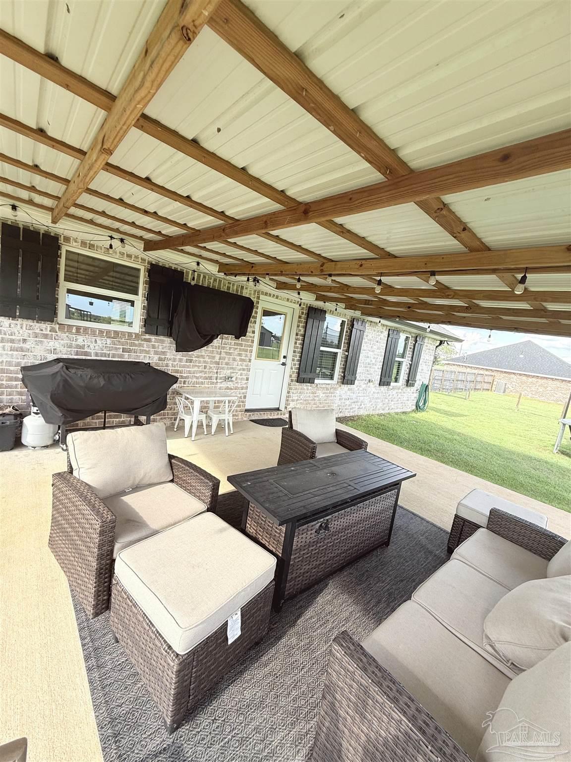 2351 Harvest Road Jay, FL 32565 - Photo 12 of 14 a living room with furniture and a large window