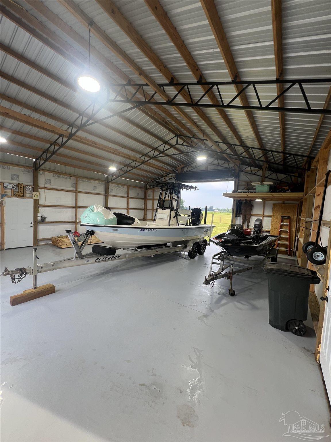 2351 Harvest Road Jay, FL 32565 - Photo 14 of 14 a view of parking garage with cars