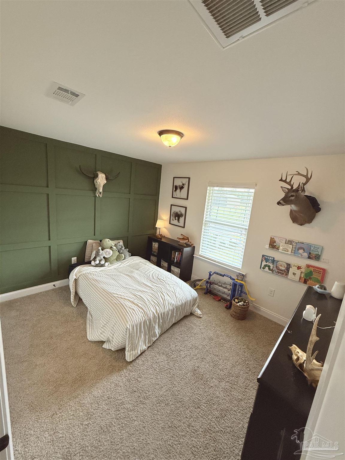 2351 Harvest Road Jay, FL 32565 - Photo 9 of 14 a bedroom with a bed and a dresser