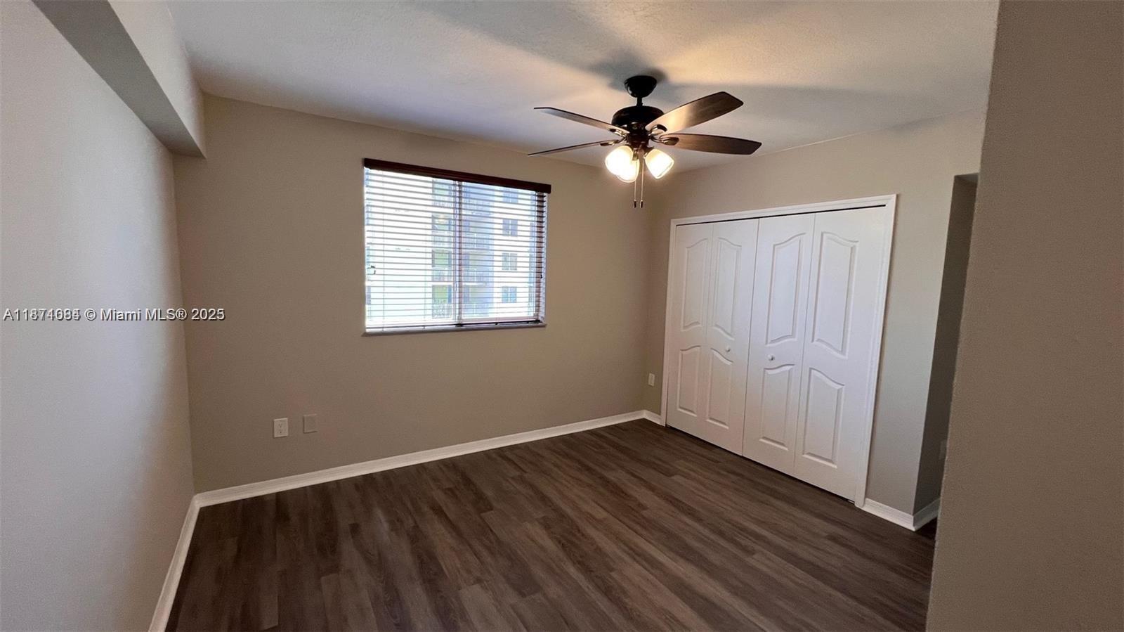 218 Northwest 12th Avenue, Unit 905 Miami, FL 33128 - Photo 8 of 15 a view of a room with wooden floor and fan
