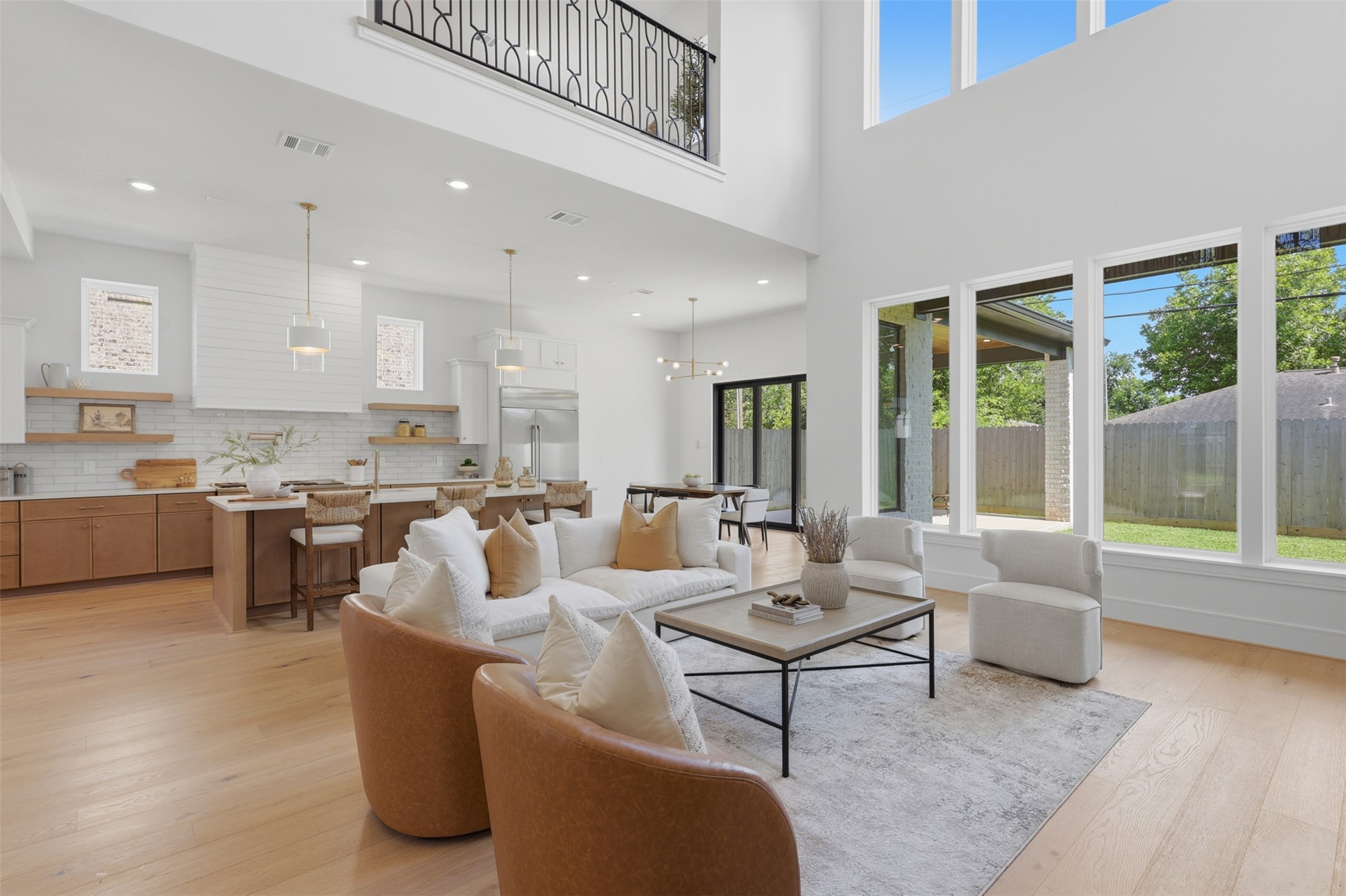 Open living with tall ceilings and stunning windows allowing for natural light