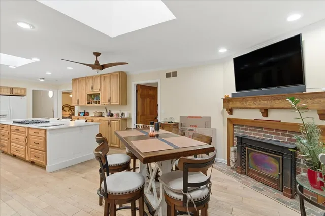 a kitchen with a stove a microwave and a refrigerator