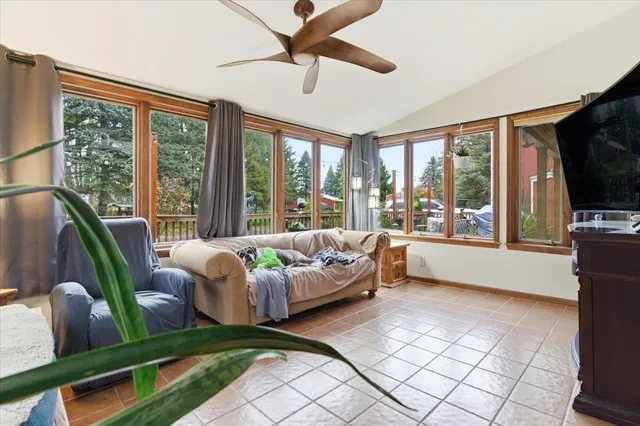 a room with a bed and a large window