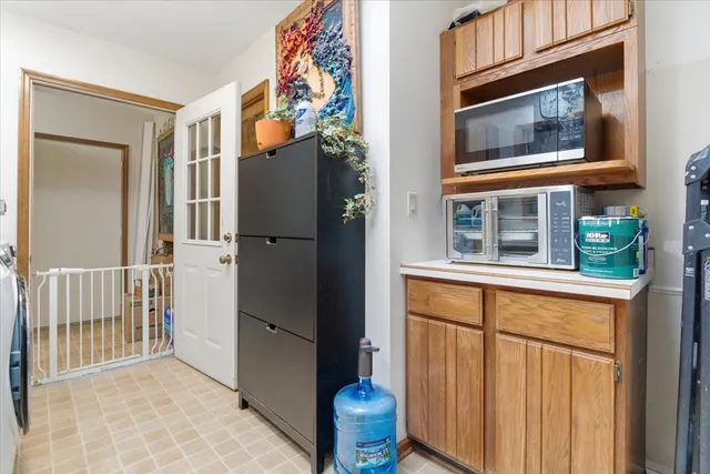 a view of a house with a door and wooden floor