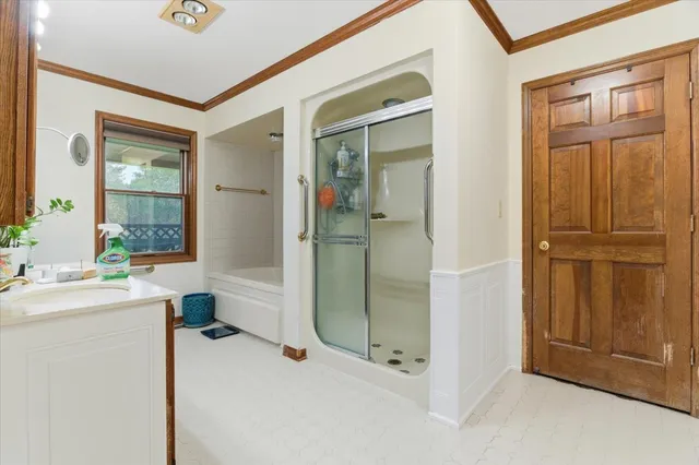 a bathroom with a shower and a sink
