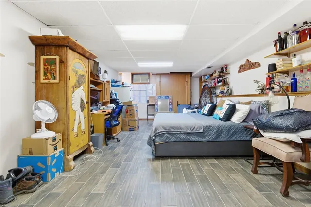 a bedroom with bed and a walk in closet