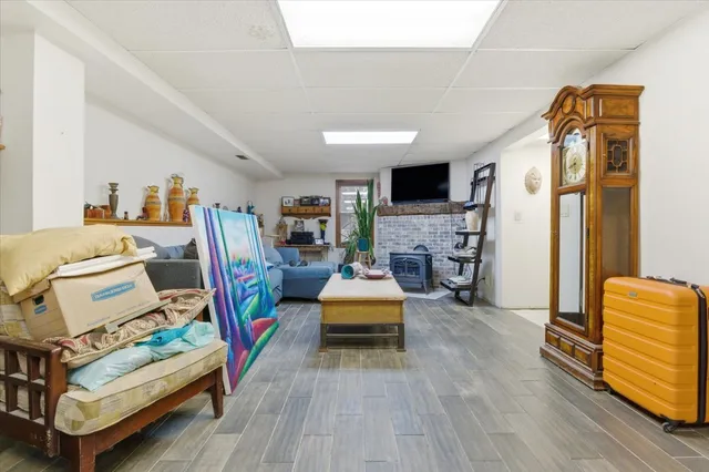 a bedroom with furniture and a wooden floor