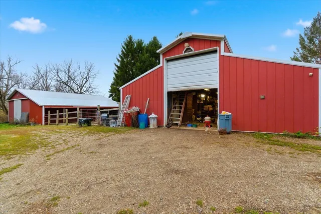 a view of a house with a yard and garage