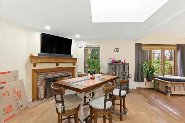 a view of a dining room with furniture window and wooden floor