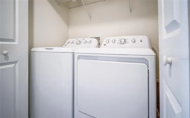 a utility room with dryer and washer
