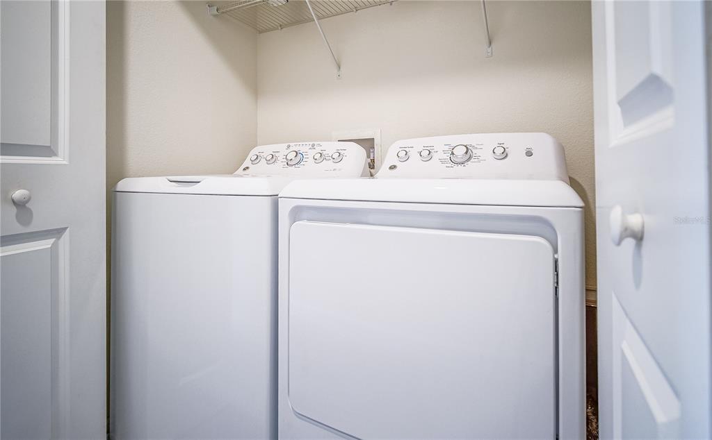 8919 Stinger Drive Davenport, FL 33896 - Photo 15 of 39 a utility room with dryer and washer