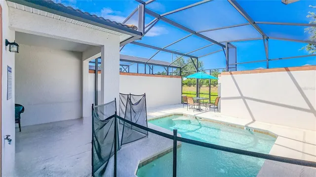 a view of a swimming pool with a patio