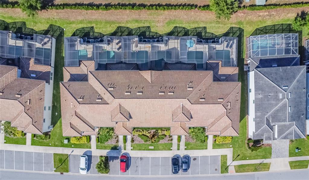 8919 Stinger Drive Davenport, FL 33896 - Photo 24 of 39 an aerial view of a house with a garden and lake view