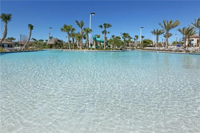 a view of a golf course with a lake