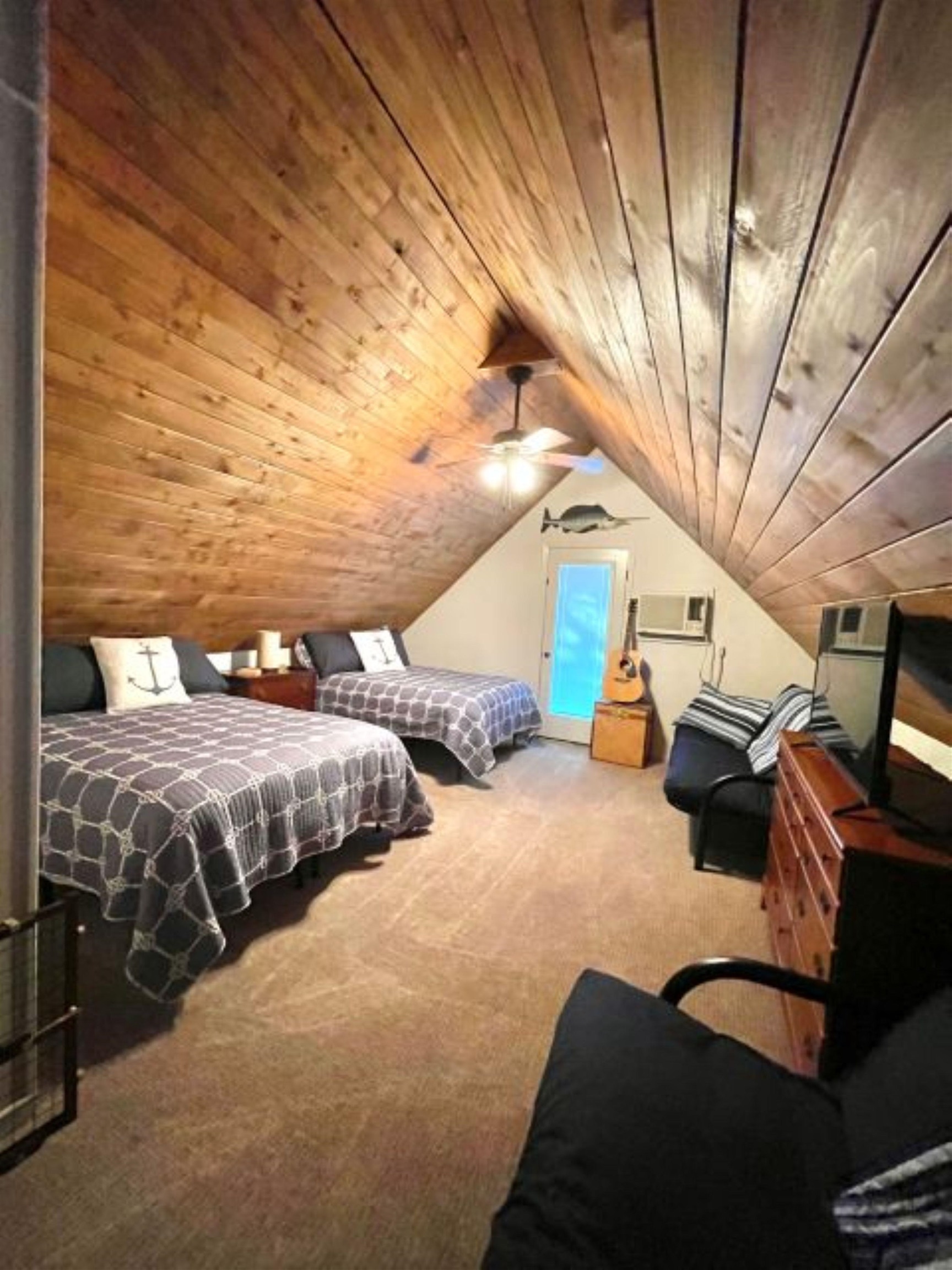 602 Sycamore Road Burnet, TX 78611 - Photo 21 of 26 a bed room with a bed and a chandelier